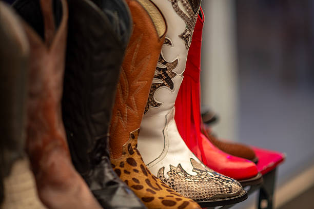 istock A row of colorful cowboy boots with various patterns 2241418614