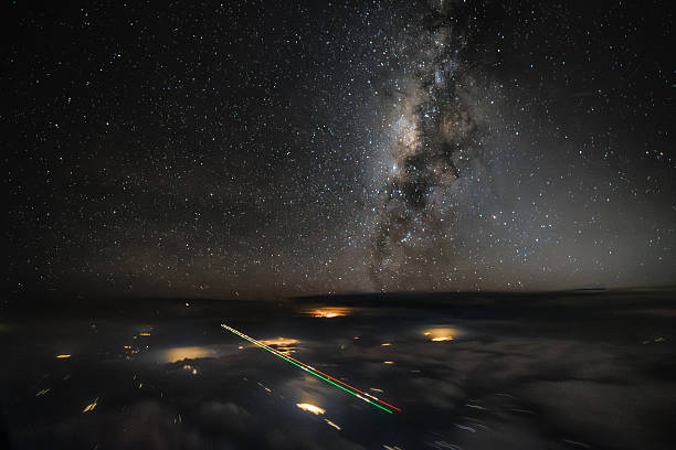 istock Milky Way above clouds from airplane cockpit with aircraft lights 2241421958