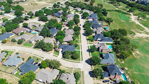 istock Manicured golf course in North Richland Hills, Texas bordered by mature trees, two story spacious suburban homes, large vacant land. Visual blend of comfort, recreation, and future development 2241422008