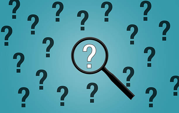 istock Magnifying Glass Over Question Marks on Blue Background, Focus on 2026 Uncertainty 2241422881