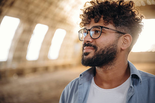 istock Cheerful man in glasses is in hangar 2241423897