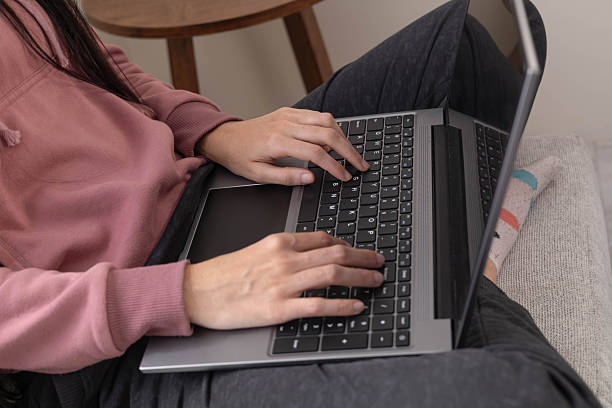 istock Woman concentrating on laptop while working from home in a peaceful environment 2241425951
