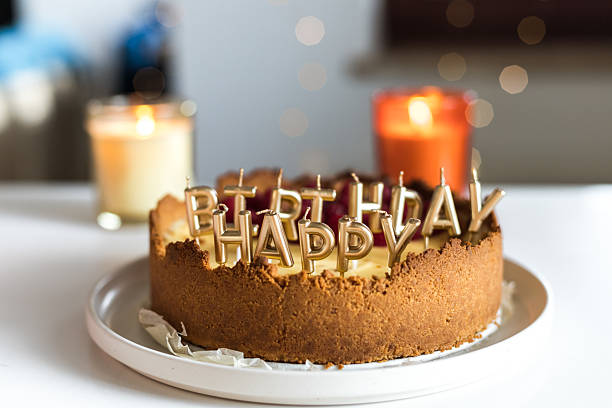 istock cheesecake birthday cake with raspberries and candles 2241426935