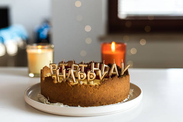 istock cheesecake birthday cake with raspberries and candles 2241427091