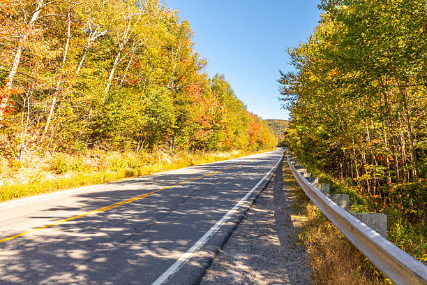 istock Two-Lane Highway in New Hampshire Mountains 2241428659