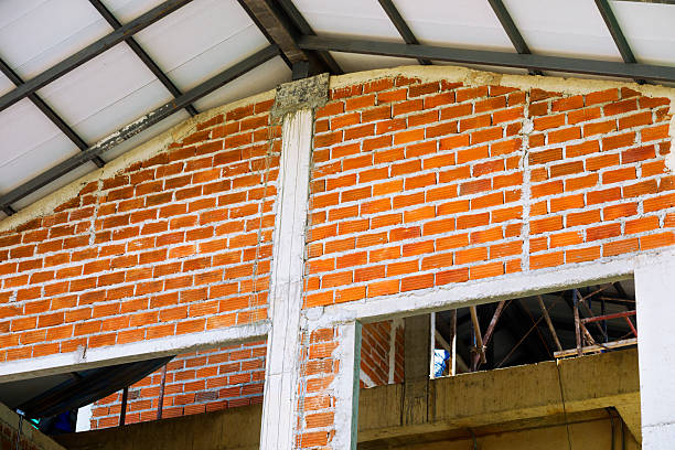 Brick wall and gable of new thai home under construction  in residential district of Bangkok Chatuchak