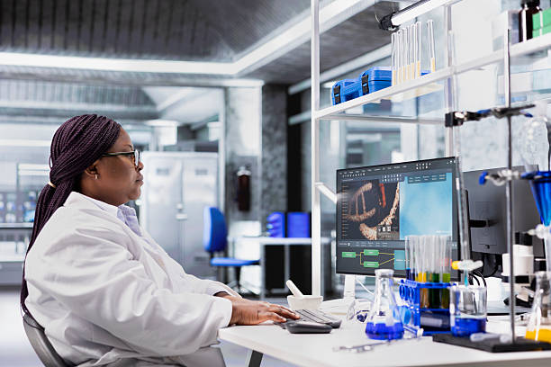 istock Black woman working in biotechnology lab surrounded by modern equipment 2241432494