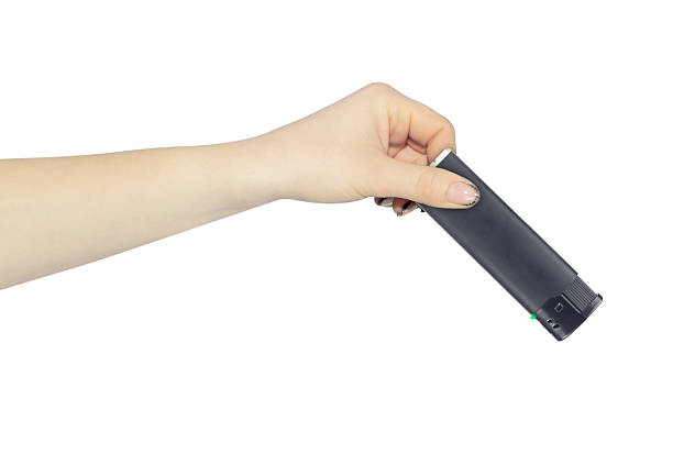 istock lighter in hand isolated from background, concept to pass or throw away 2241432886