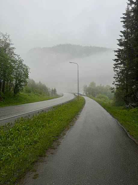 A Scenic Drive Along a Winding Road Through a Mountain Landscape Surrounded by Mist. Prao, Vietnam.
