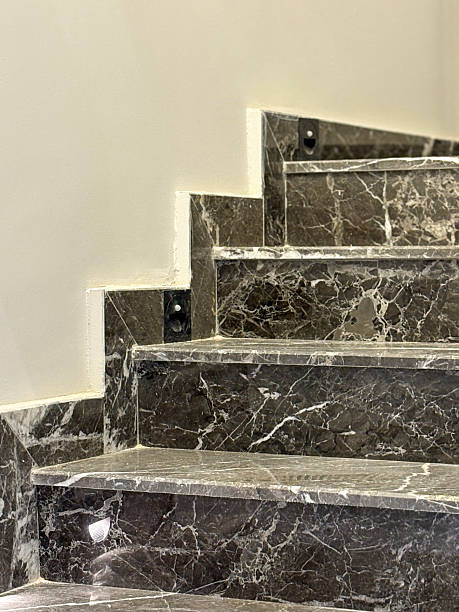 istock Home interior granite stone stairs. Modern gray marble stairs 2241439914