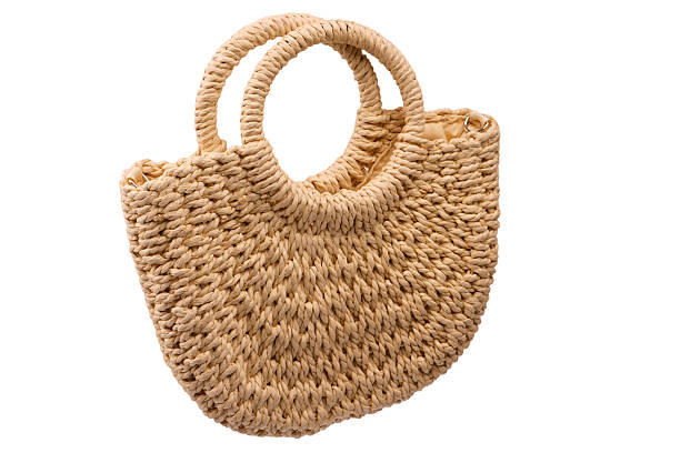 istock A beige straw bag isolated on a white background. 2241440803