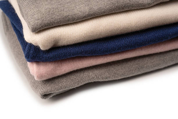 istock A group of warm sweaters isolated on a white background. 2241440824