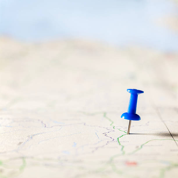 istock Blue thumbtack marking and showing destination location point on map background with copy space 2241440840