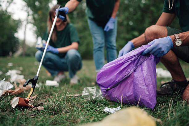 istock Volunteers cleaning park litter and picking up trash 2241442031