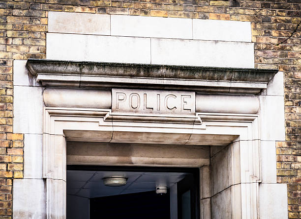 A Police sign over the entrance to a police station in Notting Hill, West London.