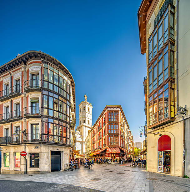 istock Cathedral tower rising above cafes in Valladolid, Spain 2241446180