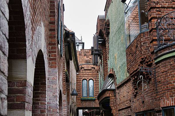 istock Historic European alley with intricate brick architecture. 2241447331