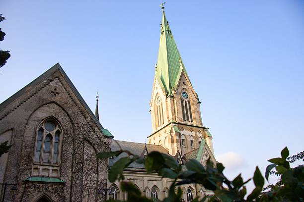 istock Gothic Cathedral Towers Above Verdant Landscape 2241451106