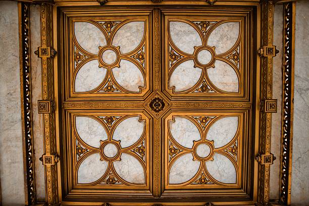 istock Ornate golden doors with intricate floral and geometric patterns 2241451910