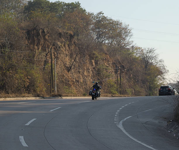 Motorcycle on the road and mountains