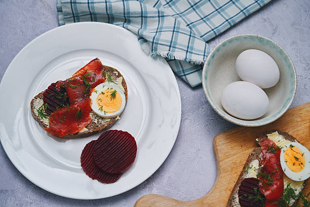 Gravadlax Scandinavian Salmon with Red Beets, Eggs on Brown Bread