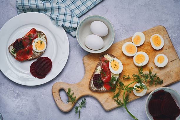 Gravadlax Scandinavian Salmon with Red Beets, Eggs on Brown Bread