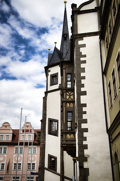 istock Historic Spire Rises in Cloudy European Cityscape 2241454751