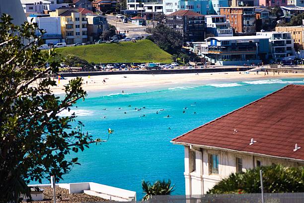 Vibrant coastal cityscape with pristine beach, lush greenery, and waves crashing against the shore, offering a captivating Mediterranean ambiance.