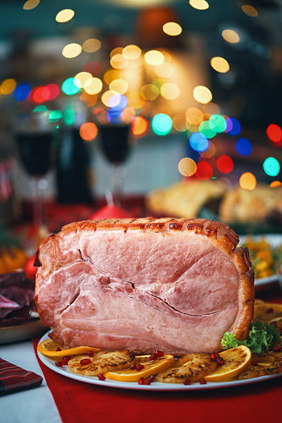 istock Christmas Dinner with Baked Glazed Ham and Various Vegetables 2241455367