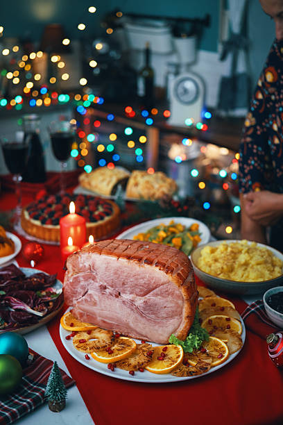 istock Christmas Dinner with Baked Glazed Ham and Various Vegetables 2241455808