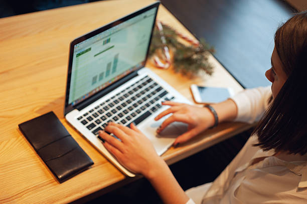 istock Woman professional work on data-driven in modern laptop insights in a light-filled office 2241455985