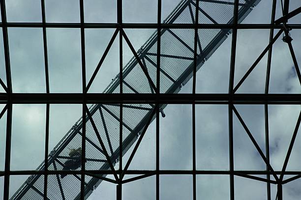 istock Steel truss bridge silhouetted against dramatic sky 2241456579
