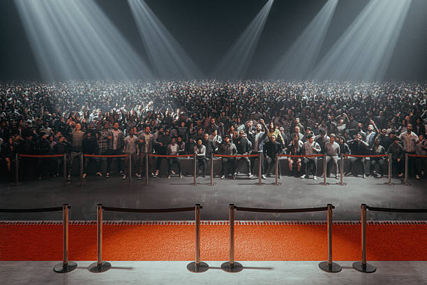 istock Ecstatic crowds of people at front of the stage 2241456776