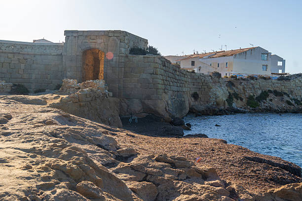 Tabarca Alicante Spain  . The Tabarca Island Historic Artistic Complex dates back to the 18th century and is surrounded by a wall of which important parts are still preserved. It is located off the coast of Alicante and is a protected marine reserve. The old gate.