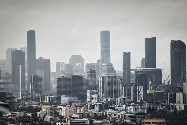 istock Skyscrapers pierce hazy sky in urban landscape 2241458874