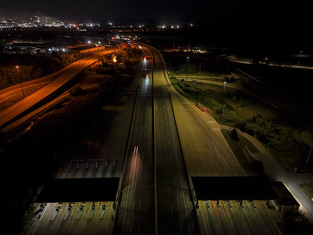 istock Busy night traffic on a long highway,illuminated by car lights, creating streaks 2241460954