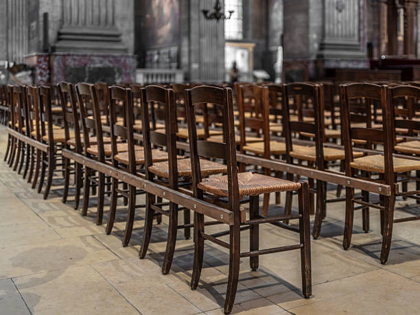 Simple rustic chairs in a church in France