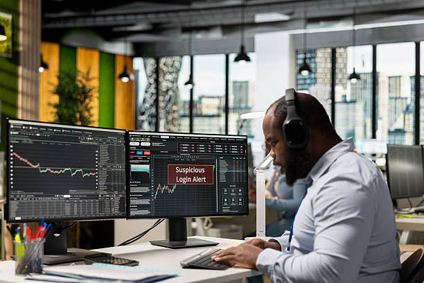 istock Trader in office receives suspicious login alert after unauthorized access 2241463289
