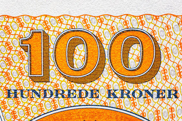 istock Denmark 100 Kroner 2003.Composer Carl Nielsen (1865-1931)Basilisk from Tommerby Kirke.Basilisk means little king; stylised ornamental cross.World money collection.Bonistics.Collection. 2241468024