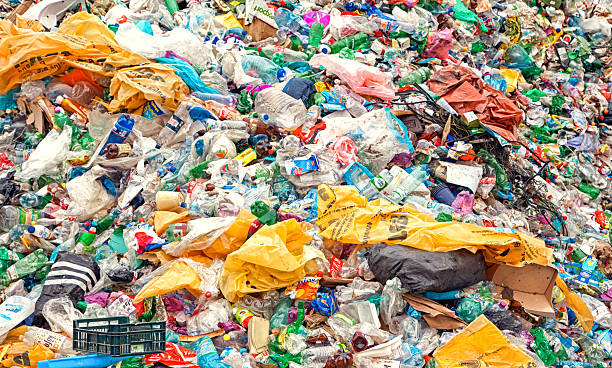 istock Plastic waste and garbage landfill with bottles and bags 2241470590
