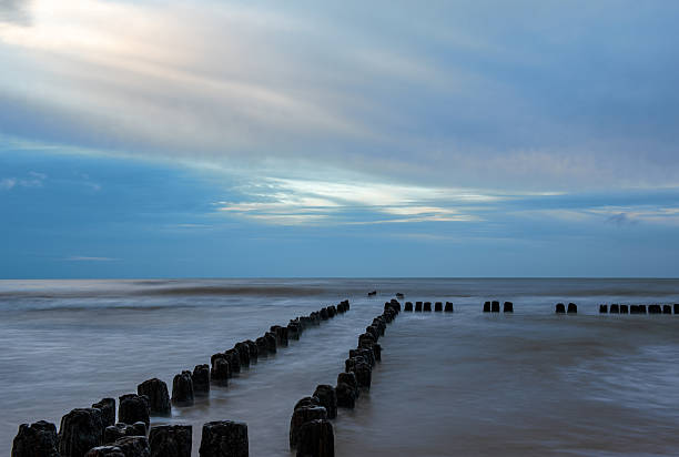 istock the sea during the blue hour, posts, pilings 2241473847