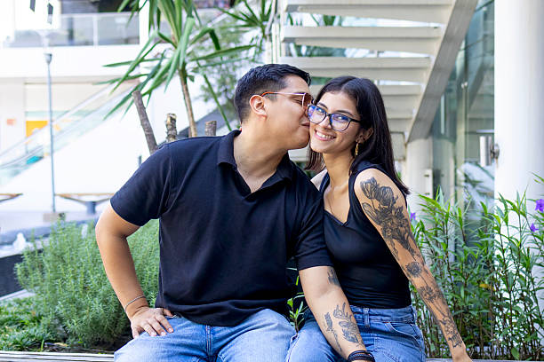 istock Man kissing his girlfriend on the cheek 2241474570