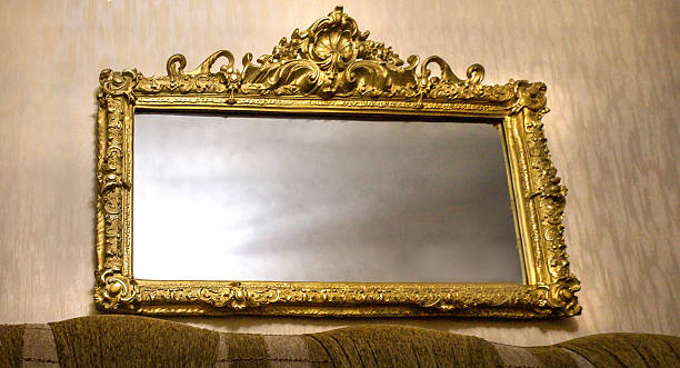 istock Mirror in goled color wooden frame 2241478279