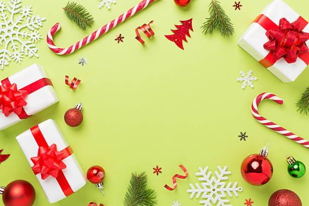istock Christmas decor, gift boxes and confetti on color background, top view. Copy space for design 2241478515