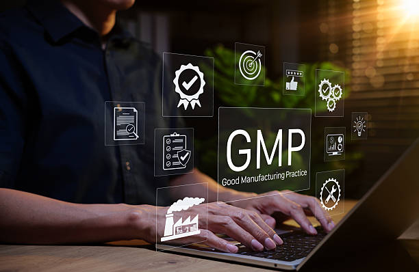istock Good Manufacturing Practice (GMP) Concept. Businessman working on laptop with icons representing compliance, quality control, assurance, certification, factory standards, certified process management, 2241479643