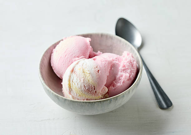 istock bowl of pink raspberry ice cream 2241480841
