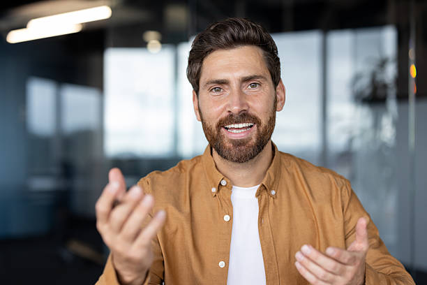istock Happy businessman smiling and gesturing during a video conference call 2241481859