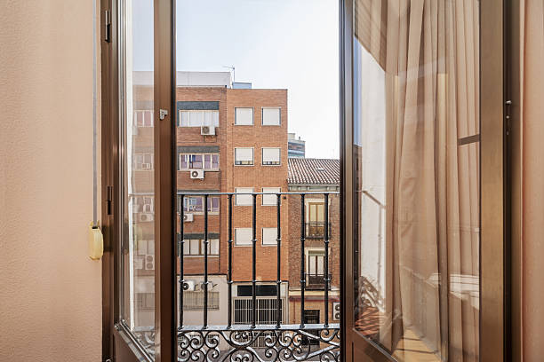 istock Small balcony of a home with artistic metal wrought iron railing 2241492971