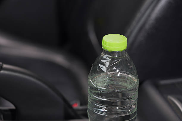 istock Drinking water in the car prepared for traveling 2241496576