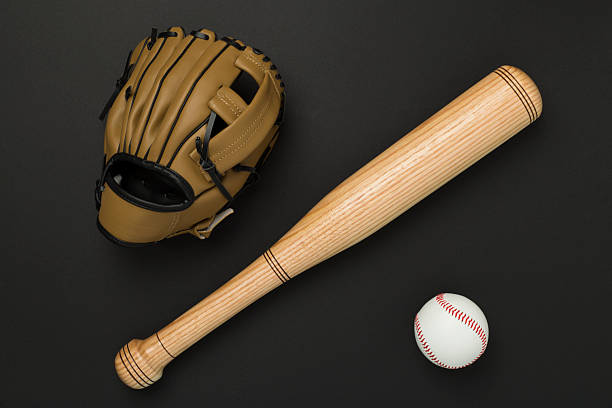 istock Baseball glove and bat with ball on color background, top view 2241497612